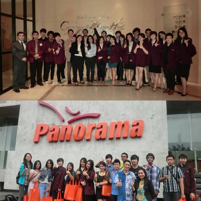 Tourism stream students pose in and out of panorama Tour office